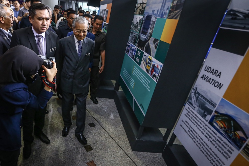 Prime Minister Tun Dr Mahathir Mohamad and Transport Minister Anthony Loke visit an exhibition booth during the launch of the National Transport Policy 2019-2030 at KL Sentral in Kuala Lumpur October 17, 2019. u00e2u20acu201d Picture by Hari Anggara