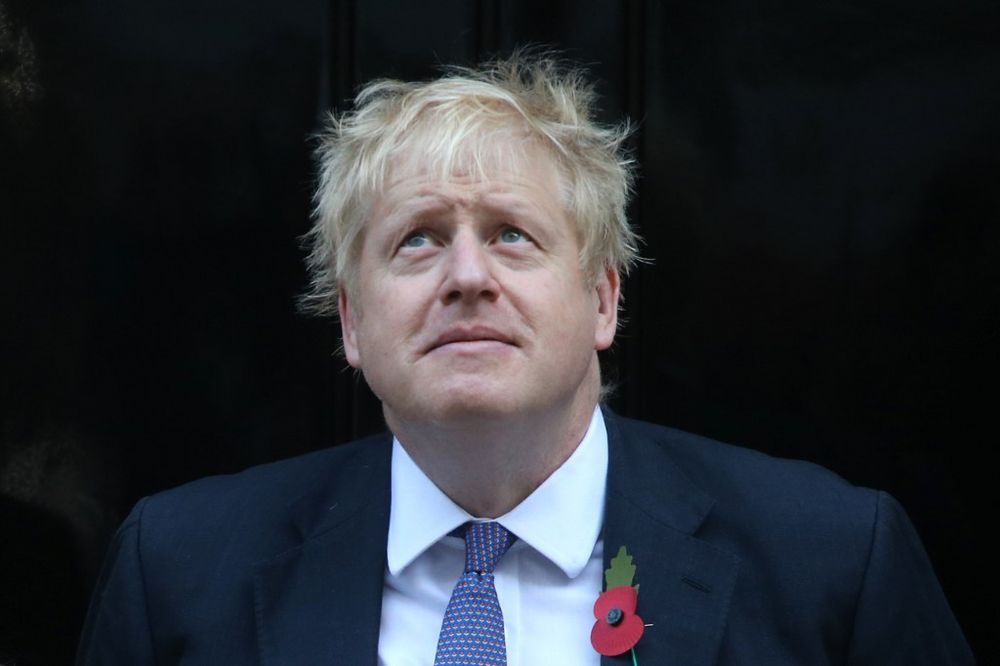 Britainu00e2u20acu2122s Prime Minister Boris Johnson looks up as he meets with fundraisers for the Royal British Legion outside 10 Downing street in central London on October 28, 2019. u00e2u20acu201d AFP pic