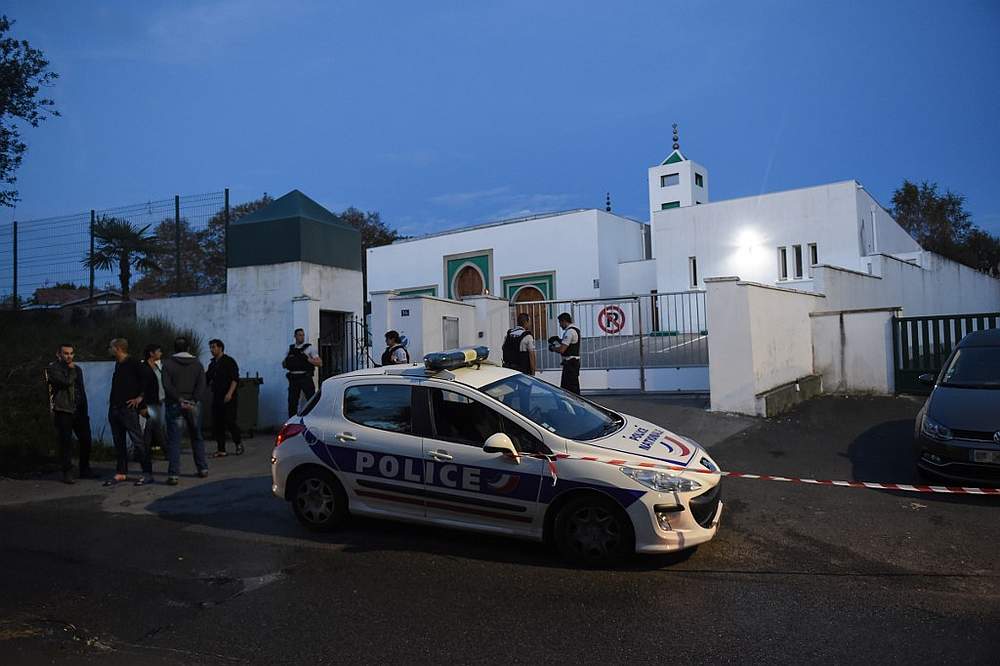 French police officers and people stand in front of the Mosque of Bayonne, southwestern France after two people were injured in a shooting October 28, 2019. u00e2u20acu201d AFP pic