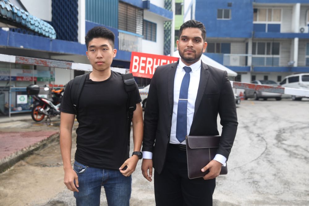 UM graduate Wong Yan Ke (left) and his legal representative Asheeq Ali  are pictured outside the Petaling police station in Kuala Lumpur October 16, 2019.u00e2u20acu201d Picture by Choo Choy May
