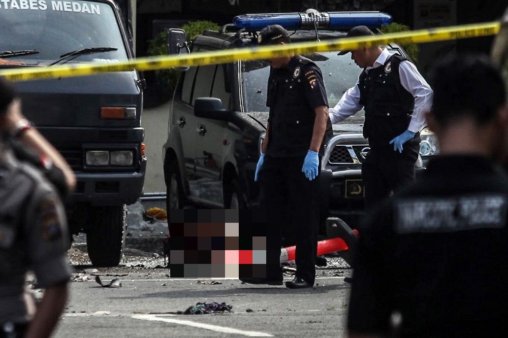 Indonesian police examine a body of a suspected suicide bomber at their headquarters in Medan, North Sumatra November 13, 2019. u00e2u20acu201d AFP pic