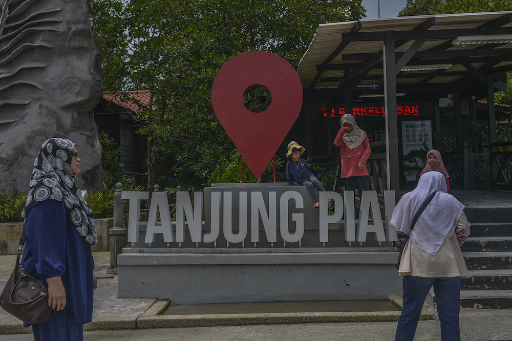 Visitors take photos at Tanjung Piai National Park in Johor November 4, 2019. u00e2u20acu201d Picture by Shafwan Zaidon