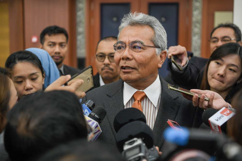 Entrepreneur Development Minister Datul Seri Mohd Redzuan Md Yusof speaks to reporters at Parliament on November 18, 2019. u00e2u20acu2022 Picture by Hari Anggara