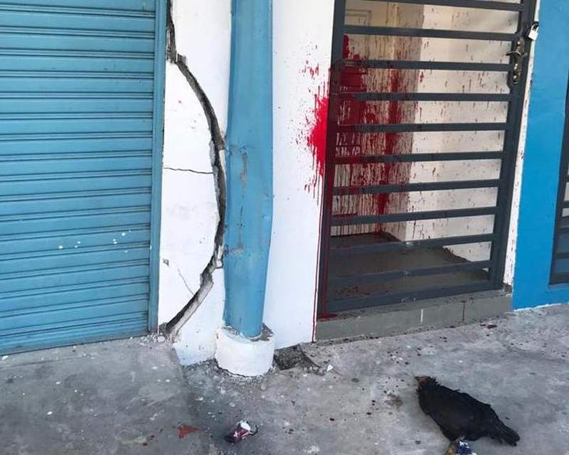 The Johor Baru Parliamentary Service Centre had been splashed with red paint and a chicken carcass with a threatening message thrown in front of the door. u00e2u20acu2022 Picture via Facebook/Akmal Nasir