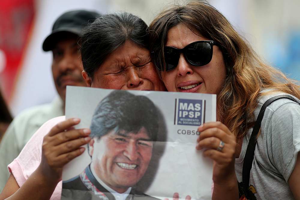A person holds a picture of Bolivian President Evo Morales during a demonstration in support of him after he announced his resignation on Sunday, in Buenos Aires, Argentina November 11, 2019. u00e2u20acu201d Reuters pic