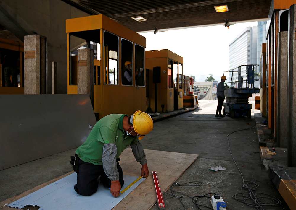 A worker repairs toll booths damaged during protests, at the Cross Harbour Tunnel near Hong Kong Polytechnic University in Hong Kong November 23, 2019. u00e2u20acu201d Reuters pic