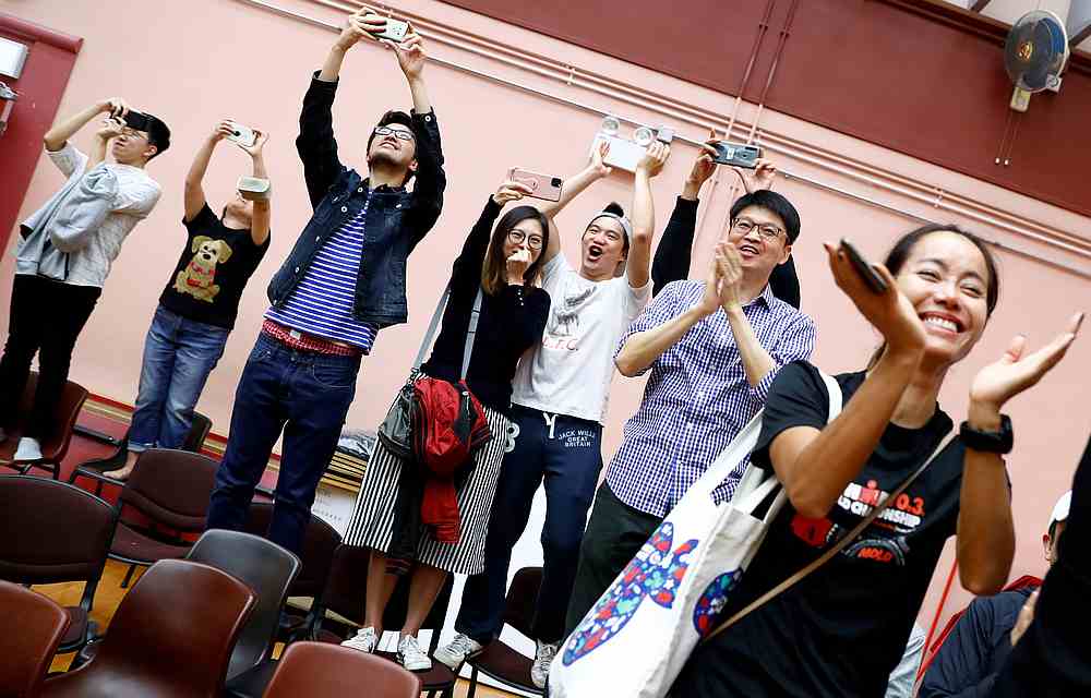 Supporters of local candidate Kelvin Lam celebrate, after it was announced he won the local council elections in his district, at the South Horizons West district in Hong Kong November 25, 2019. u00e2u20acu201d Reuters pic 