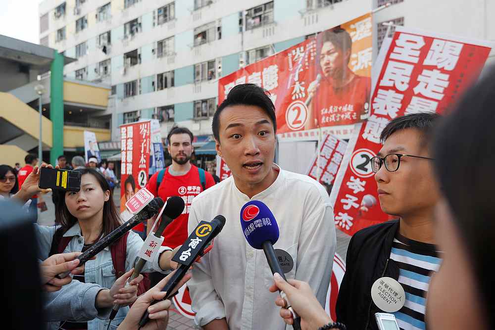 Candidate Jimmy Sham talks to media outside a polling station during district council local elections in Hong Kong November 24, 2019. u00e2u20acu201d Reuters pic