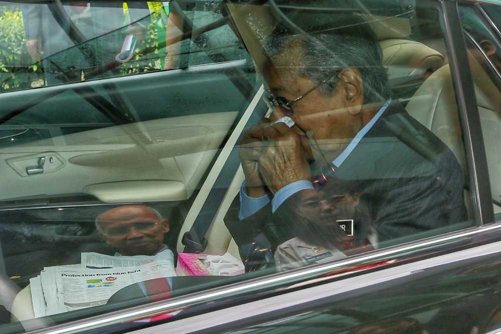 Prime Minister Tun Dr Mahathir Mohamad wipes his nose with a white handkerchief after cutting short a press conference in Kuala Lumpur November 19, 2019. u00e2u20acu2022 Picture by Ahmad Zamzahuri