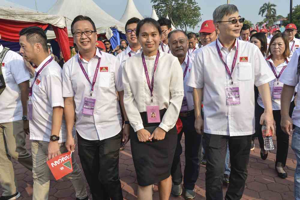 Gerakanu00e2u20acu2122s Wendy and her entourage who wore white-and-red and were seen making their way to the nomination centre from Jalan Dewan at about 8.15am. u00e2u20acu2022 Picture by Shafwan Zaidon