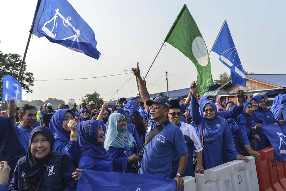 Barisan Nasional supporters are seen outside the Dewan Jubli Intan Sultan Ibrahim in Pontian November 2, 2019. u00e2u20acu2022 Picture by Shafwan Zaidon