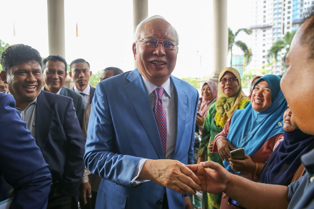 Former prime minister Datuk Seri Najib Razak is greeted by supporters at the Kuala Lumpur Courts Complex December 3, 2019. u00e2u20acu201d Picture by Yusof Mat Isa