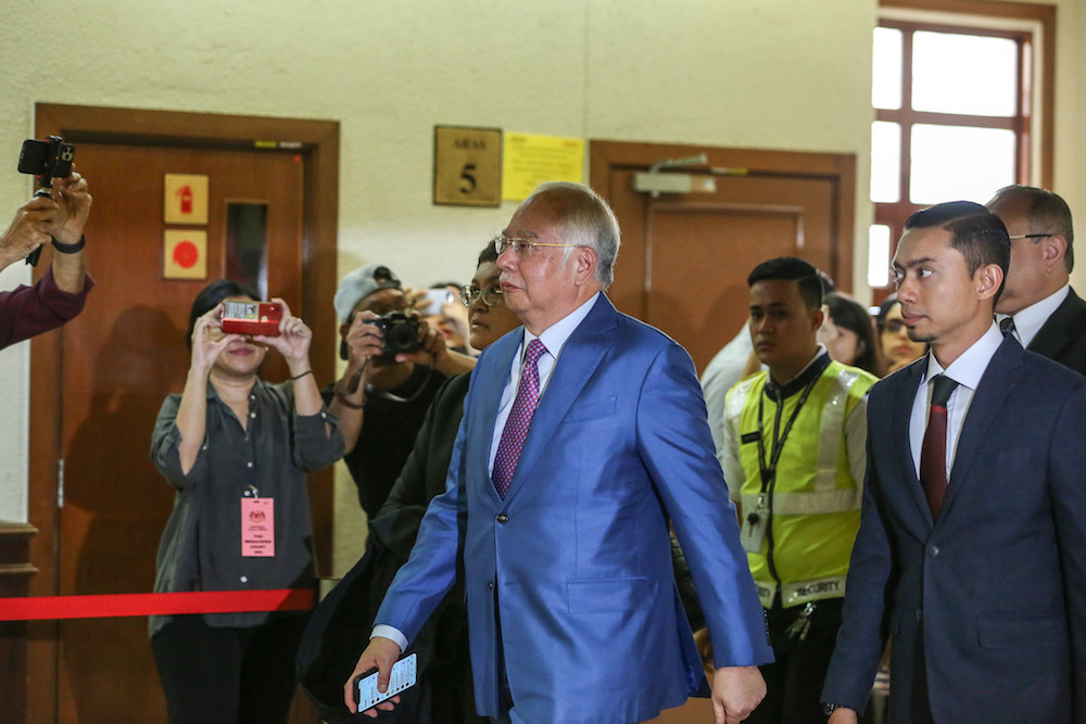 Former prime minister Datuk Seri Najib Razak walks past the media scrum at the Kuala Lumpur Courts Complex December 3, 2019. u00e2u20acu201d Picture by Yusof Mat Isa