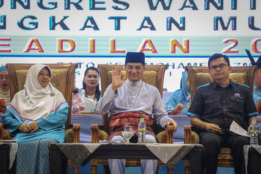 PKR deputy president Datuk Seri Azmin Ali (centre) with PKR Youth chief Akmal Nasrullah (right) and Wanita PKR chief Haniza Mohamed Talha at the opening of the 2019 Woman and Youth National Congress in Melaka December 5, 2019. u00e2u20acu201d Picture by Yusof Mat Isa