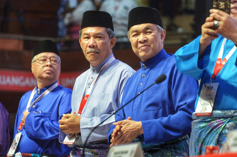 Umno president Datuk Seri Ahmad Zahid Hamidi and Umno deputy president, Datuk Seri Mohamad Hassan give standing ovation during the Umno General Assembly 2019 at PWTC in Kuala Lumpur December 7, 2019 u00e2u20acu201d Picture by Shafwan Zaidon