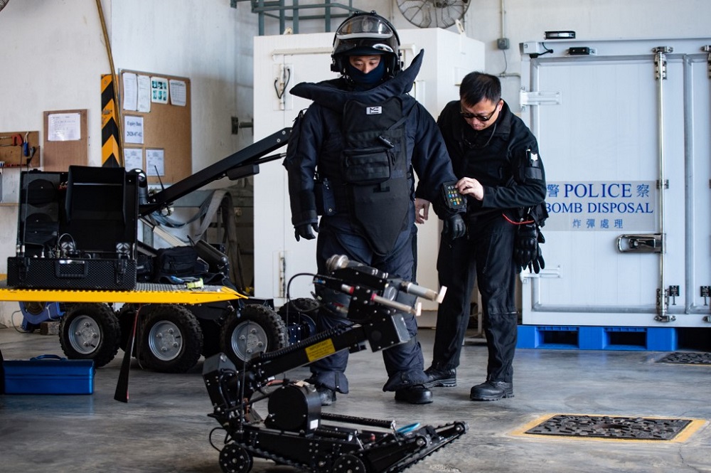 A police officer (left) wears a bomb suit during a media tour of the Hong Kong Police Explosive Ordnance Disposal Bureau depot in Hong Kong December 6, 2019. u00e2u20acu201d AFP pic