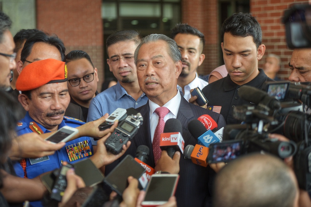 Home Minister Tan Sri Muhyiddin Yassin speaks to reporters after flagging off the Floods Humanitarian Mission by the Anak Muda NGO in Putrajaya December 11, 2019. u00e2u20acu201d Picture by Shafwan Zaidon