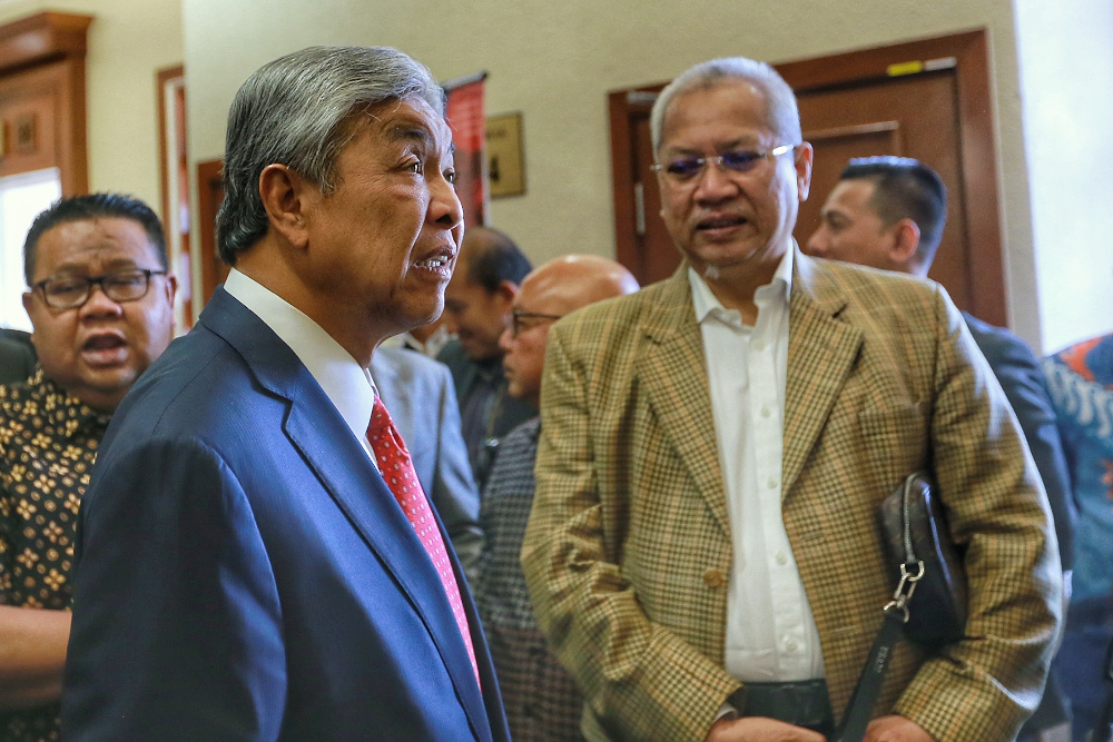 Datuk Seri Ahmad Zahid Hamidi is pictured at Kuala Lumpur High Court together with Tan Sri Annuar Musa December 12, 2019. u00e2u20acu201d Picture by Ahmad Zamzahuri