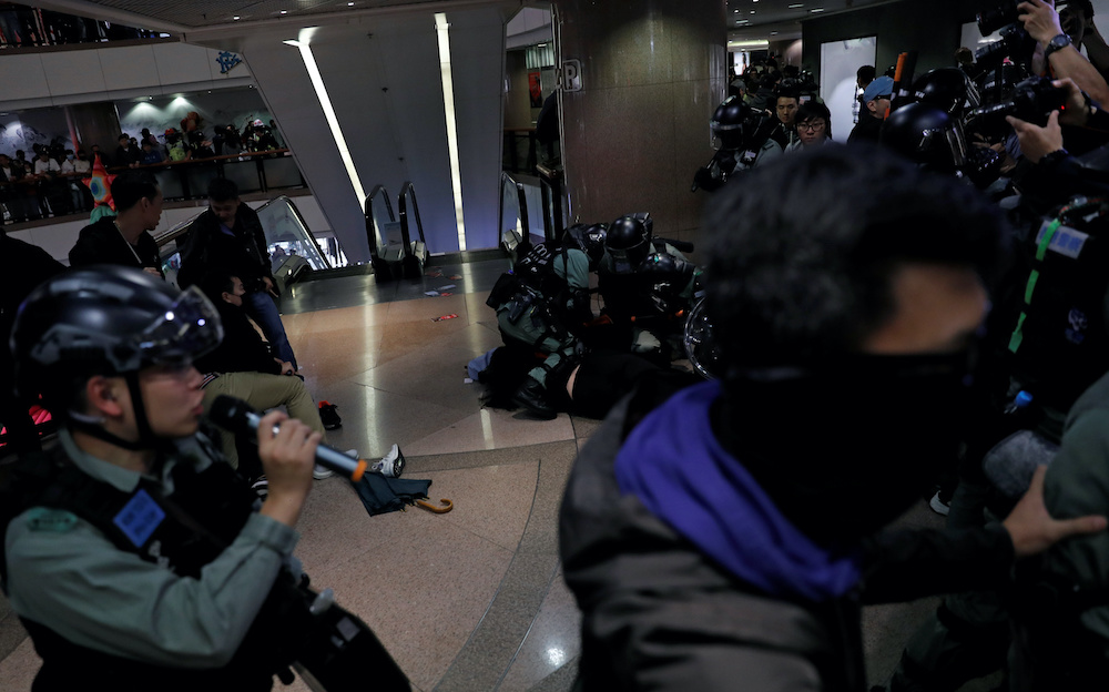 Riot police officers detain an anti-government demonstrators during a protest inside a shopping mall on Christmas Eve in Hong Kong December 24, 2019. u00e2u20acu201d Reuters pic