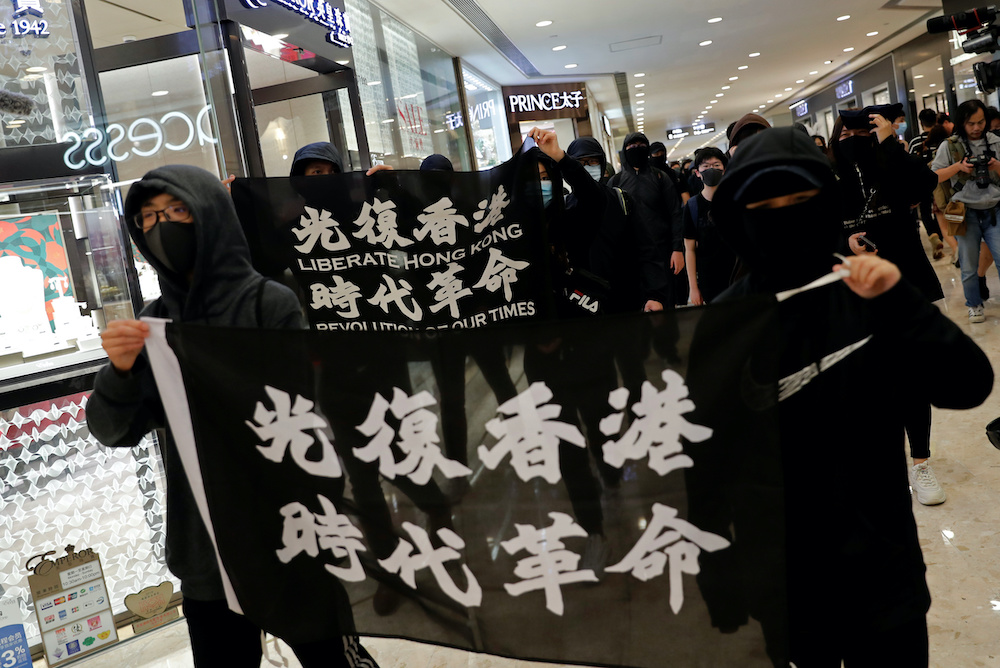 Anti-government protesters march at a shopping mall on Christmas Eve at Tsim Sha Tsui in Hong Kong, China, December 24, 2019. u00e2u20acu201du00c2u00a0Reuters pic