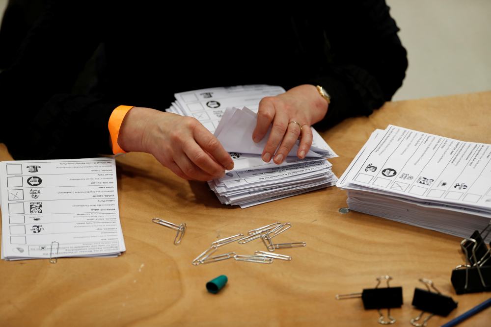 Ballots are tallied at a counting centre for Britain's general election in Brighton December 12, 2019. u00e2u20acu2022 Reuters pic