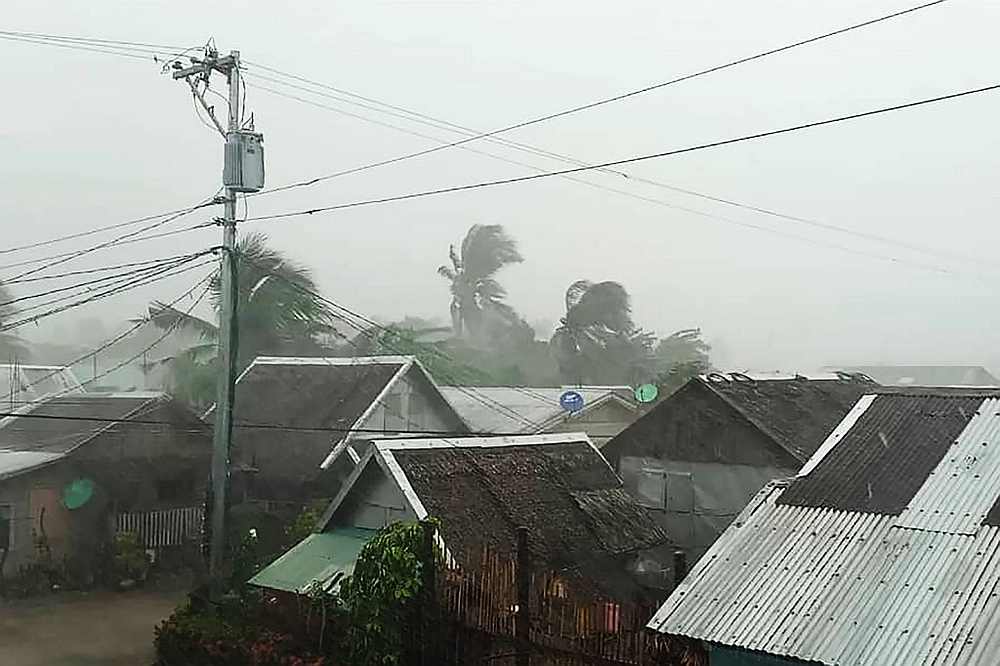 Heavy rains and moderate wind from Typhoon Kammuri battering houses in Gamay town, Northern Samar province, Philippines December 2, 2019. u00e2u20acu201d Gladys Vidal handout via AFP