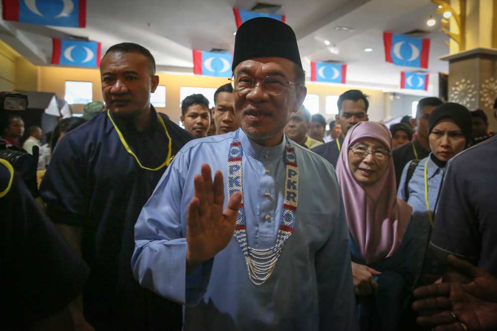 PKR president Datuk Seri Anwar Ibrahim (centre) arrives at the 2019 PKR National Congress in Melaka December 7, 2019. u00e2u20acu2022 Picture by Yusof Mat Isa