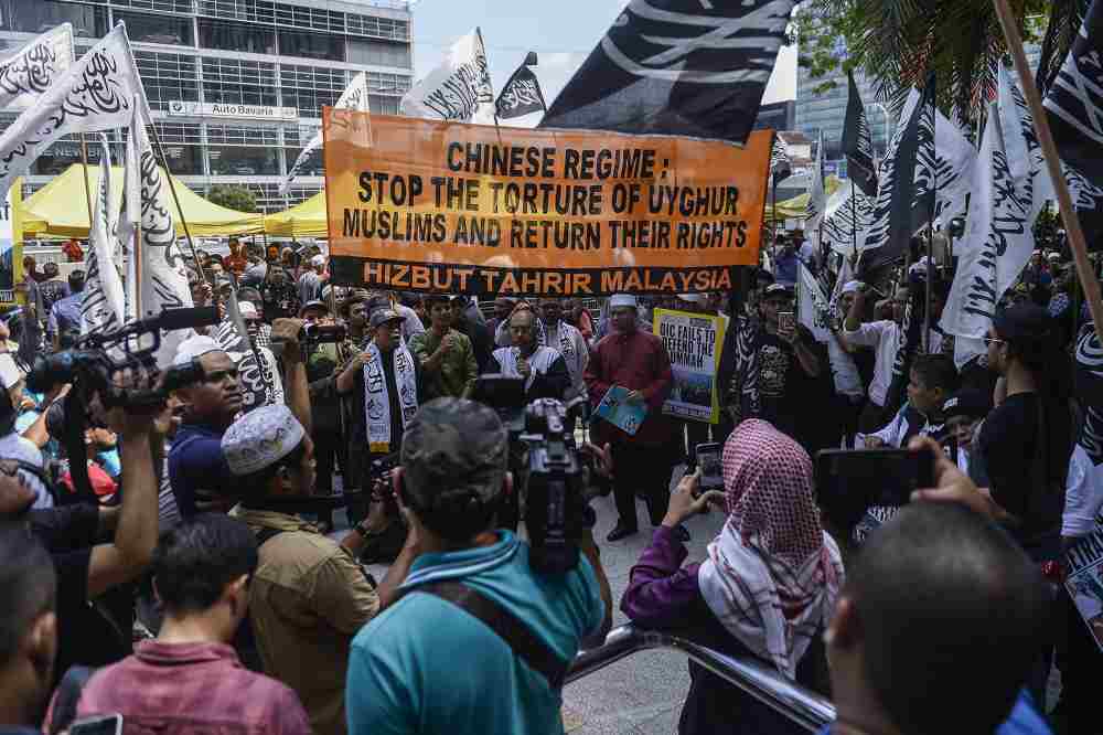 Hizbut Tahrir protesters carry placards during a protest held in solidarity with the Uighur community in China, December 27, 2019. u00e2u20acu2022 Picture by Miera Zulyana