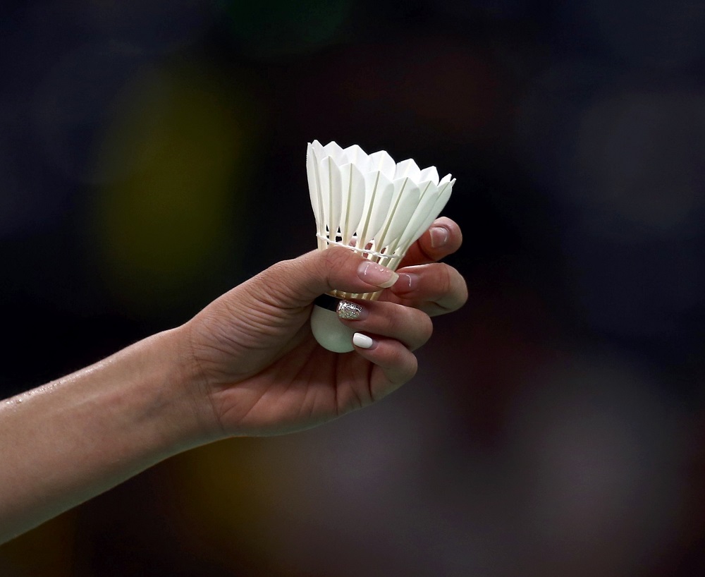 The painted fingernails of Michelle Li of Canada are seen as she holds the shuttlecock during her match against PV Sindhu of India at the Rio Olympics in Rio de Janeiro August 14, 2016. u00e2u20acu201d Reuters pic