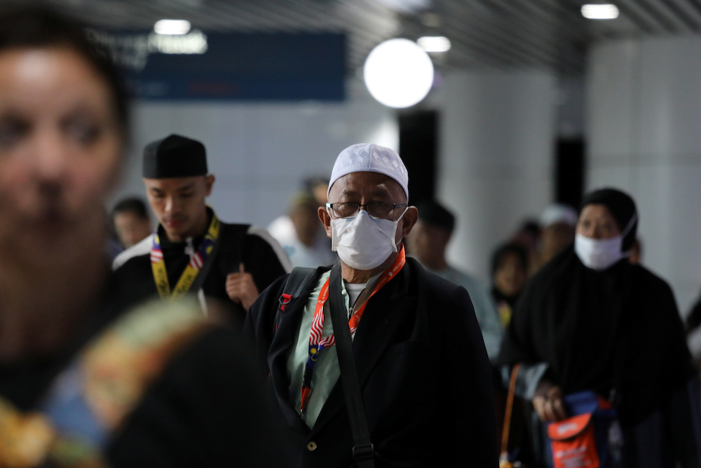 A passenger wears a mask at Kuala Lumpur International Airport in Sepang January 21, 2020. u00e2u20acu201d Reuters pic