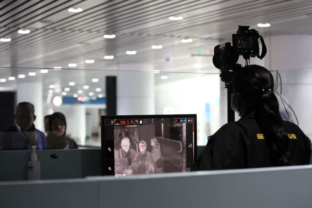 Passengers stop for a thermal screening at Kuala Lumpur International Airport in Sepang January 21, 2020. u00e2u20acu201d Reuters pic