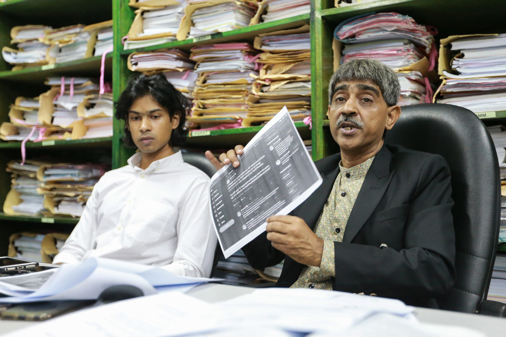 Muhammad Yusoff Rawtheru00e2u20acu2122s lawyer Haniff Khatri (right) speaks to reporters during a press conference in Petaling Jaya January 17,2 020. u00e2u20acu201d Picture by Ahmad Zamzahuri
