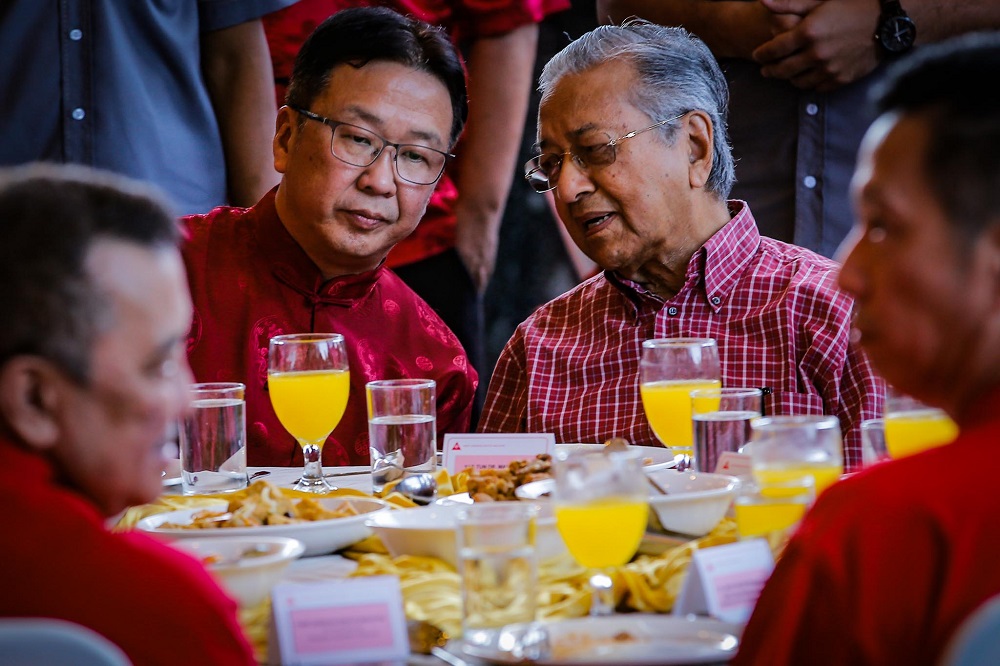 Prime Minister Tun Dr Mahathir Mohamad (right) speaks to Gerakan president Datuk Dominic Lau (left) during the Chinese New Year Open House hosted by Gerakan at the PGRM Tower in Kuala Lumpur January 25, 2020. u00e2u20acu201d Picture by Hari Anggara