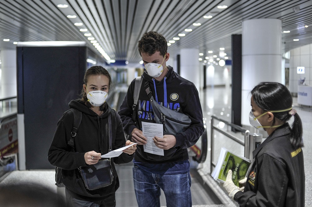 People are seen wearing protective masks at the arrival hall in KLIA 2, Sepang January 27, 2020. u00e2u20acu201d Picture by Shafwan Zaidon