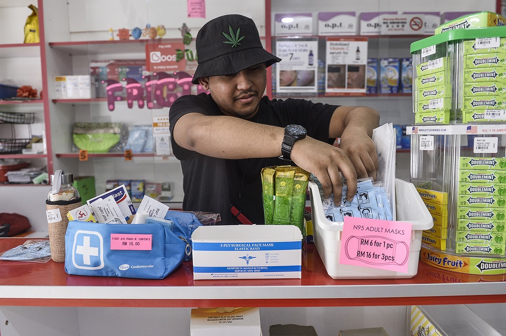 A man arranges face masks at a the counter of a Pharmhouse Pharmacy outlet in Setia Alam January 28,2020. u00e2u20acu201d Picture by Miera Zulyana