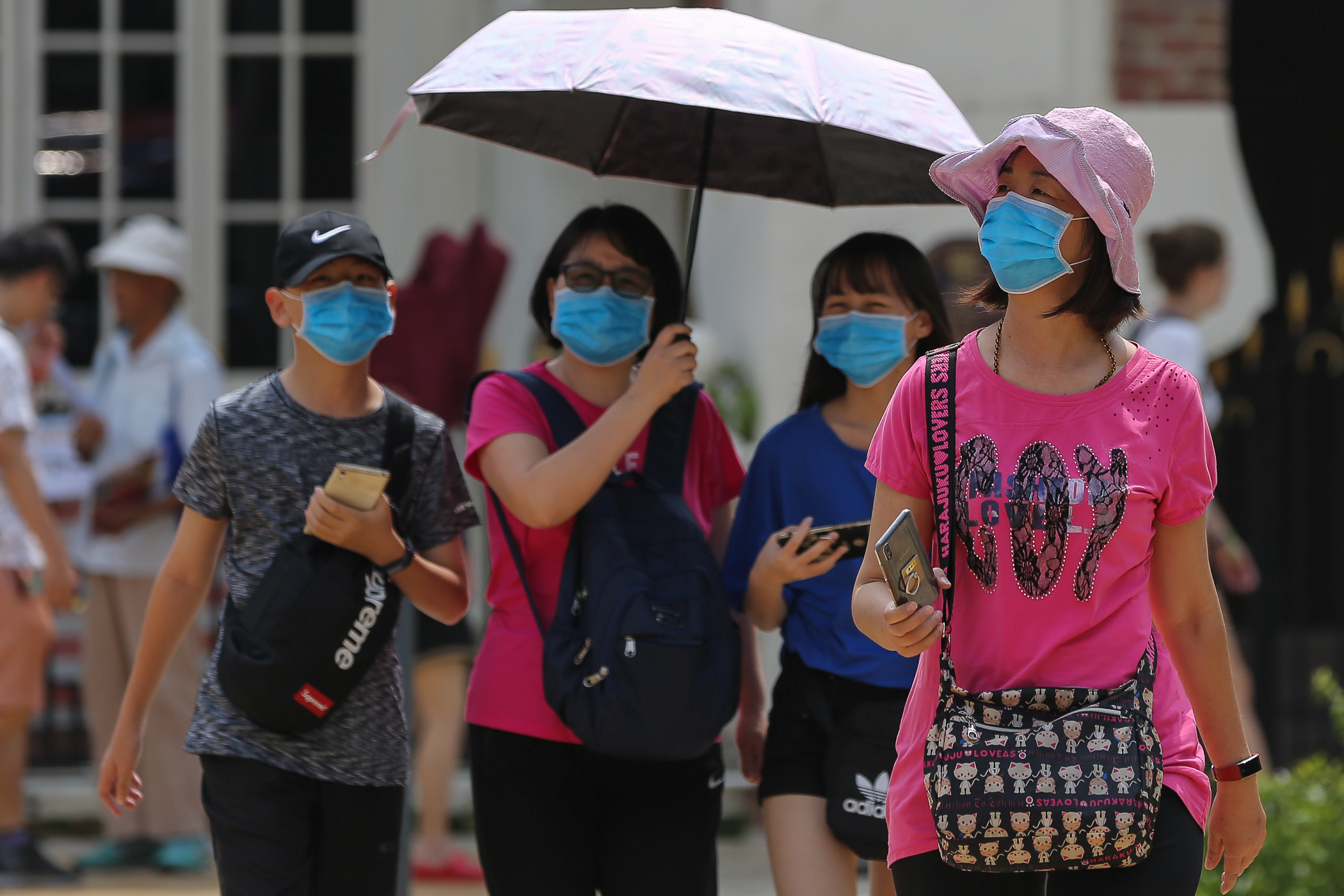 Chinese tourists wearing protective face masks are seen at the Dataran Merdeka in Kuala Lumpur January 28, 2020. u00e2u20acu201d Picture by Yusof Mat Isa