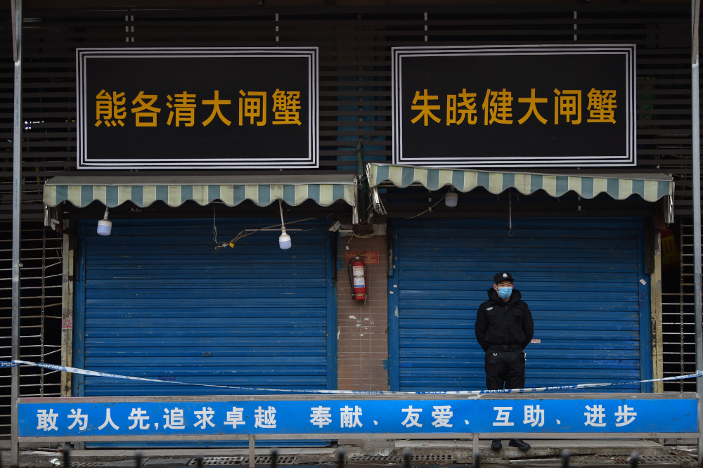 A security guard stands outside the Huanan Seafood Wholesale Market where the coronavirus was detected in Wuhan January 24, 2020. u00e2u20acu201d AFP pic