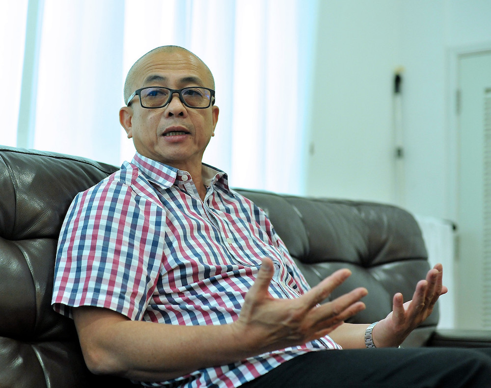 Labuan MP Datuk Rozman Isli addresses a press conference in Labuan December 11, 2019. u00e2u20acu201d Bernama pic