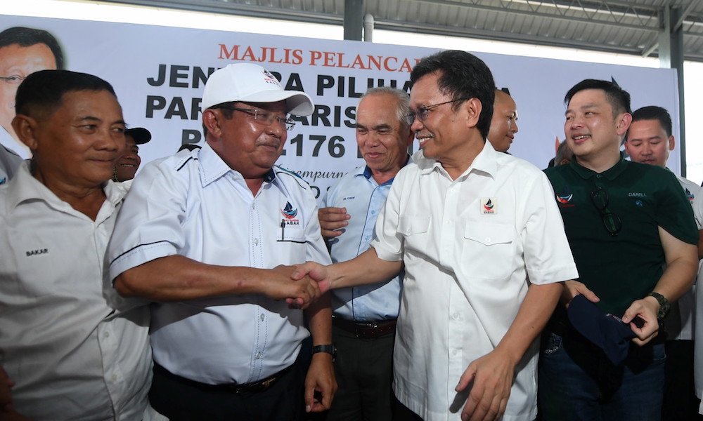 Sabah Chief Minister Datuk Seri Mohd Shafie Apdal shakes hands with Warisan candidate for the Kimanis by-election Datuk Karim Bujang in Kimanis January 2, 2020. u00e2u20acu201d Bernama pic