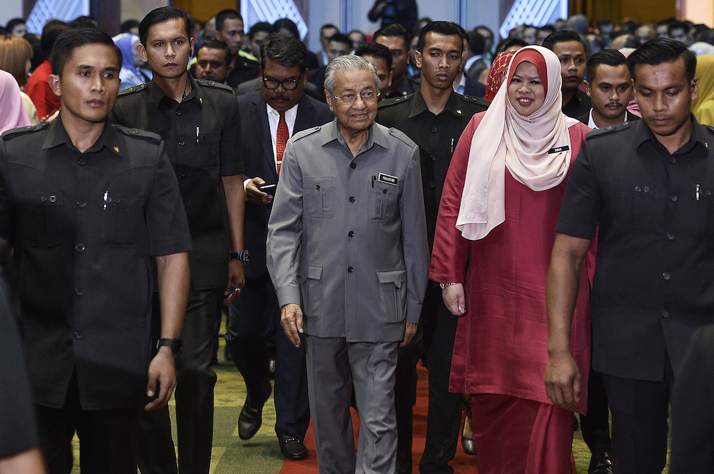 Prime Minister Tun Dr Mahathir Mohamad and Rural Development Minister Datuk Seri Rina Harun arrive for a stakeholdersu00e2u20acu2122 meeting organised by the Rural Development Ministry in Putrajaya January 30, 2020. u00e2u20acu201d Picture by Miera Zulyana