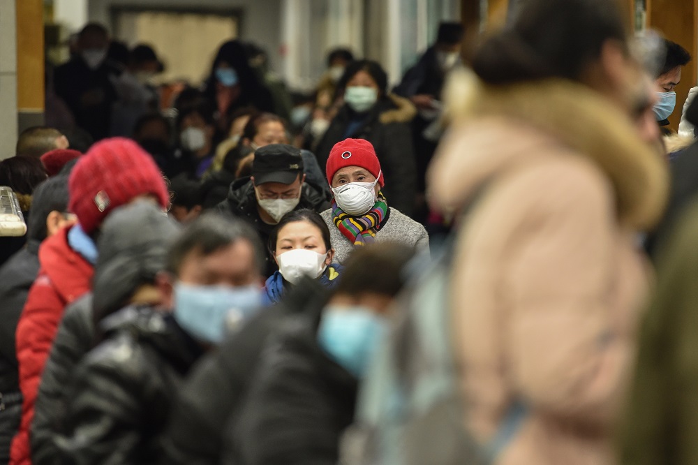 People wearing facemasks to help stop the spread of a deadly virus which began in the city, wait at Wuhan Red Cross Hospital in Wuhan January 24, 2020. u00e2u20acu201d AFP pic