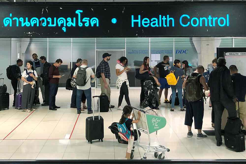 Tourist line-up in a health control at the arrival section at Suvarnabhumi international airport in Bangkok, Thailand January 19, 2020. u00e2u20acu201d Reuters pic