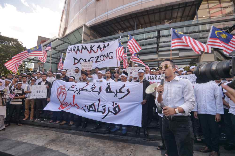 Protesters hold placards as they staged a peaceful protest in Kuala Lumpur January 1, 2020. u00e2u20acu2022 Picture by Shafwan Zaidon  