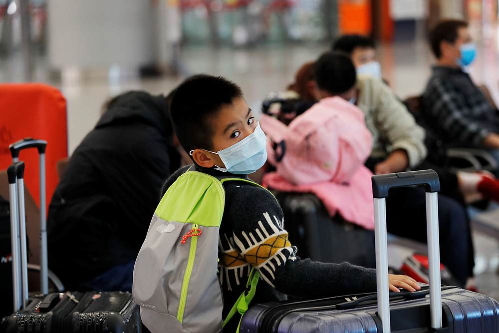 A child wears mask at Hong Kong West Kowloon High Speed Train Station Terminus, before temporary closing, following the coronavirus outbreak in Hong Kong January 29, 2020. u00e2u20acu201d Reuters pic