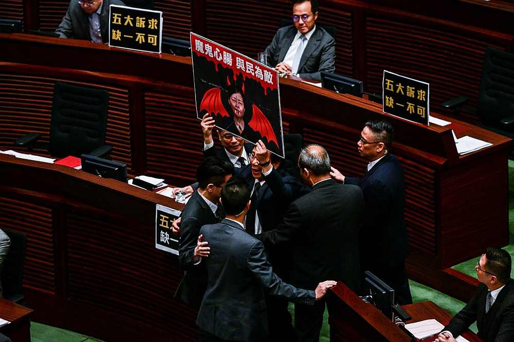 Pro-democracy lawmaker Kwok Ka-ki holds a sign as he is removed from the legislature during a question and answer session with Hong Kongu00e2u20acu2122s Chief Executive Carrie Lam (not pictured) January 16, 2020. u00e2u20acu201d AFP pic