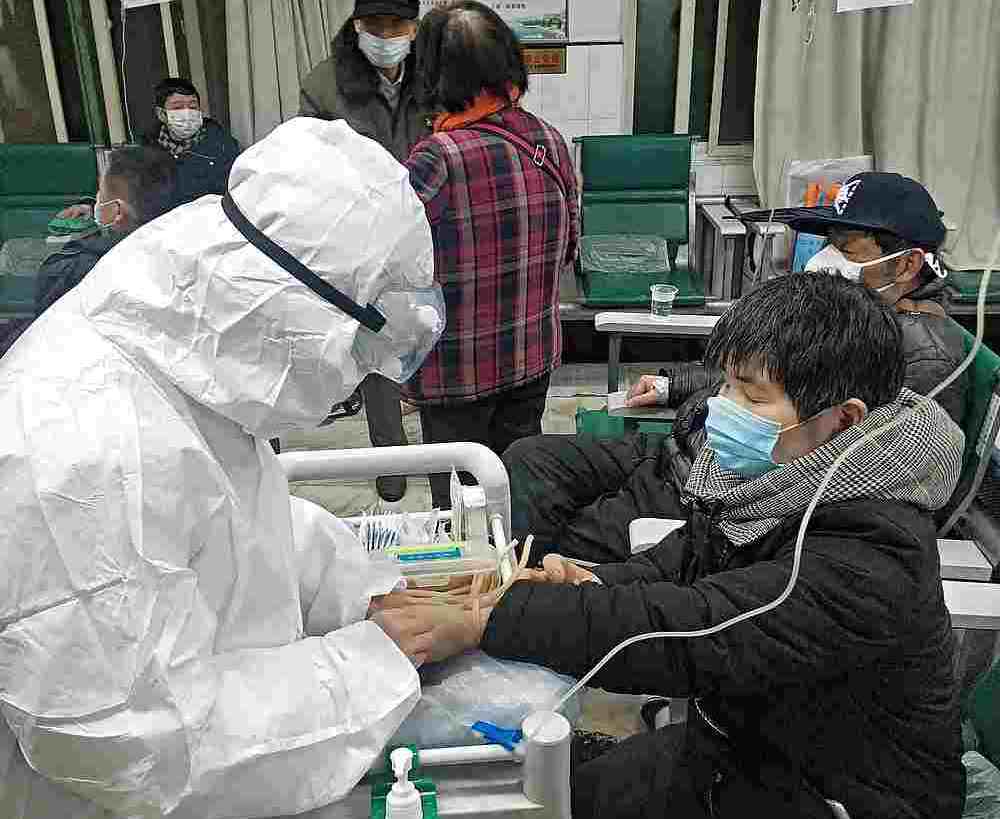 Patient Yang Zhongyi, 53, taking drips at the Wuhan Eighth hospital, Hubei province, China January 25, 2020. u00e2u20acu201d Reuters pic