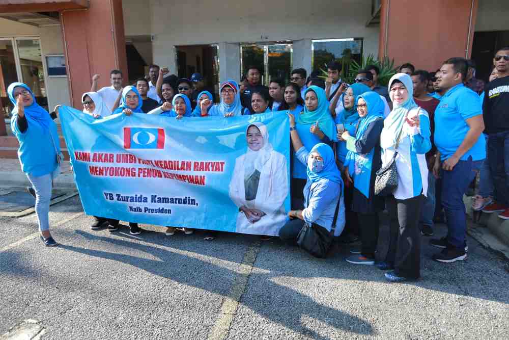 PKR supporters gather outside the partyu00e2u20acu2122s headquarters in Petaling Jaya January 18, 2020. u00e2u20acu2022 Picture by Ahmad Zamzahuri