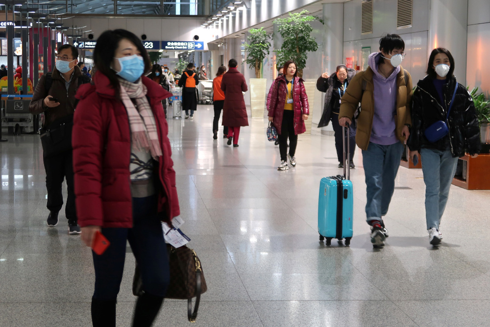 Passengers wearing masks are seen at the terminal hall of the Beijing Capital International Airport, in Beijing January 23, 2020. u00e2u20acu201d Reuters pic