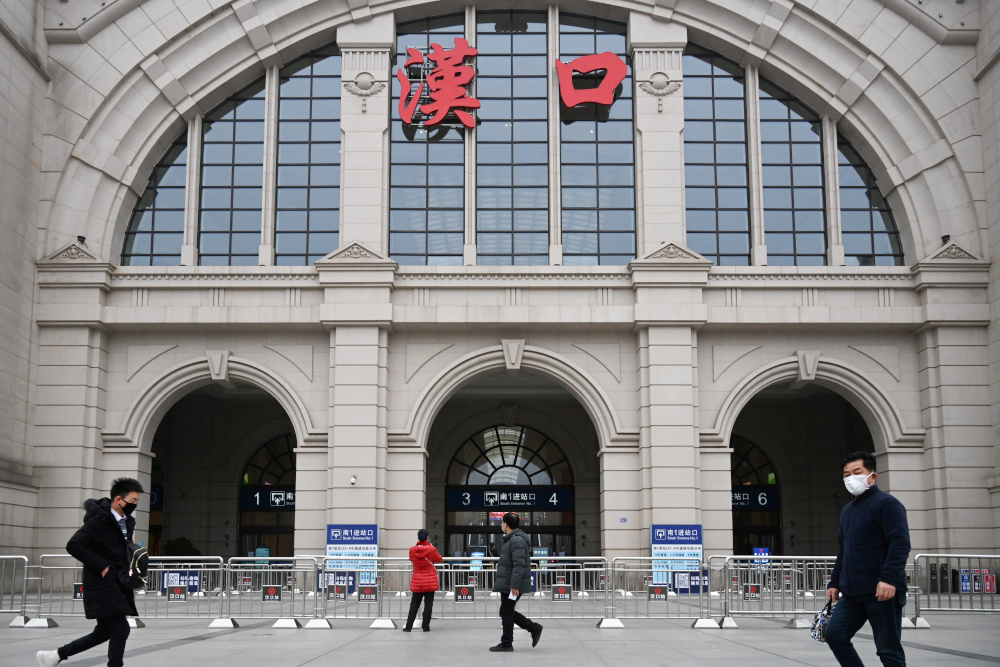 People walk past the closed Hankou Railway Station after the city was locked down following the outbreak of a new coronavirus in Wuhan, Hubei province January 23, 2020. u00e2u20acu201d Picture by China Daily via Reuters