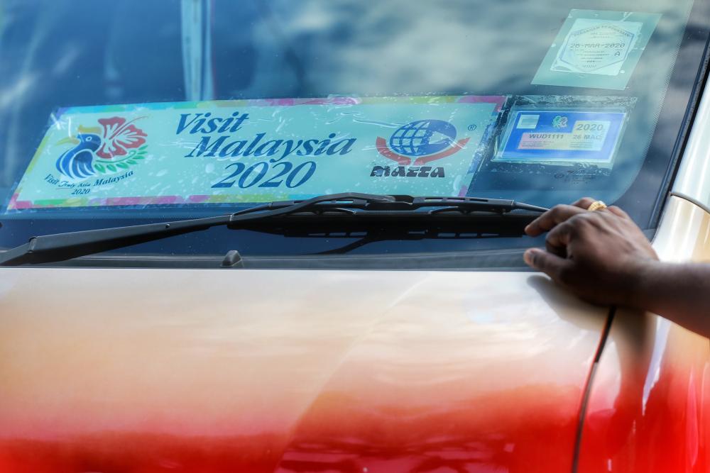 The Visit Malaysia 2020 Matta vehicle stickers are seen on a caru00e2u20acu2122s windscreen in Kuala Lumpur January 3, 2020. u00e2u20acu2022 Picture by Ahmad Zamzahuri  